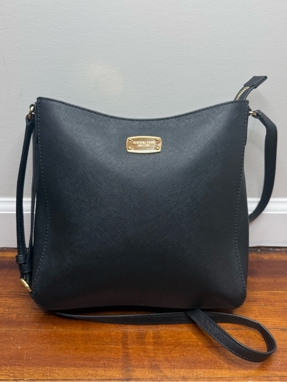 Michael Kors medium crossbody handbag features gold-toned